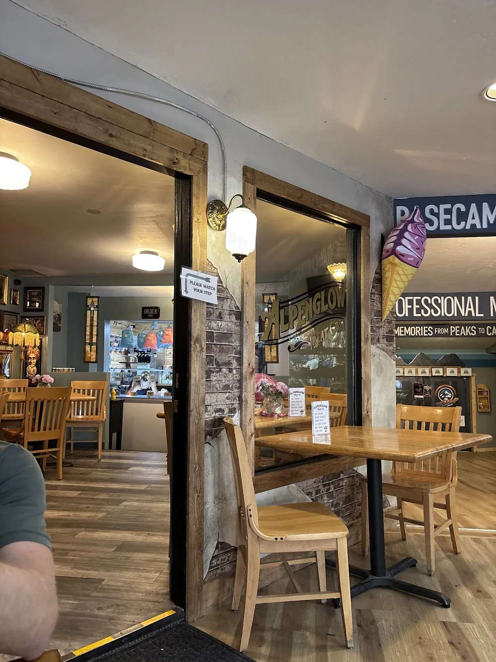 Wood tables and vintage decor inside Alpenglow Treat Co
